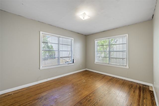 unfurnished room featuring hardwood / wood-style floors