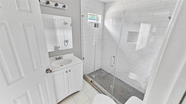 7120 Ave O, Houston, TX 77011 - full bathroom with vanity, tile patterned floors, a stall shower, and toilet