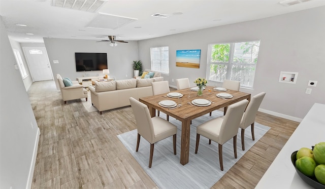 dining room featuring light hardwood / wood-style flooring and ceiling fan