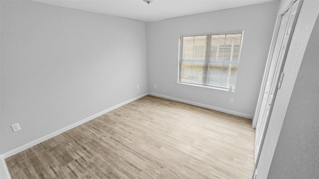 7120 Ave O, Houston, TX 77011 - empty room with baseboards and light wood finished floors