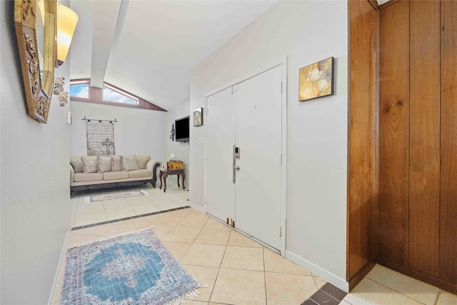 tiled foyer entrance featuring lofted ceiling with beams