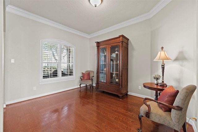 living area featuring crown molding, baseboards, and dark wood-style flooring