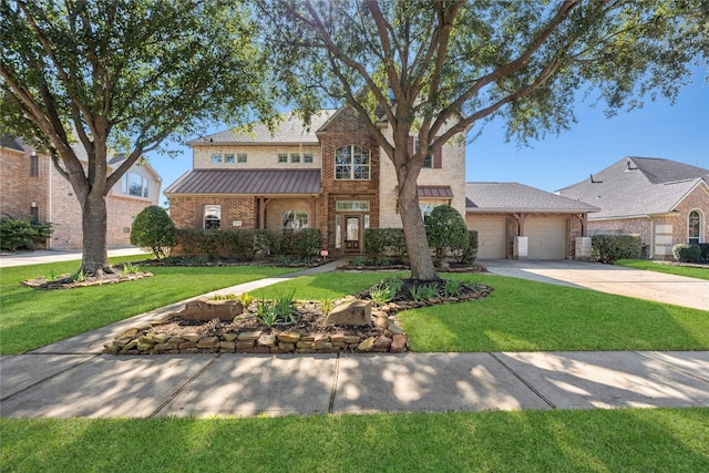 traditional home featuring brick siding, a standing seam roof, an attached garage, and a front yard