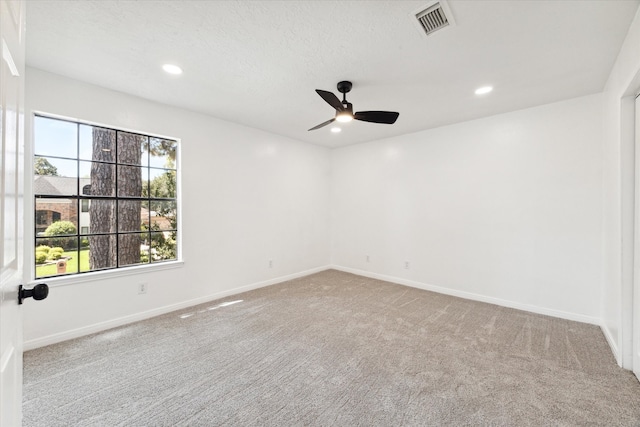 unfurnished room with carpet, a textured ceiling, and ceiling fan