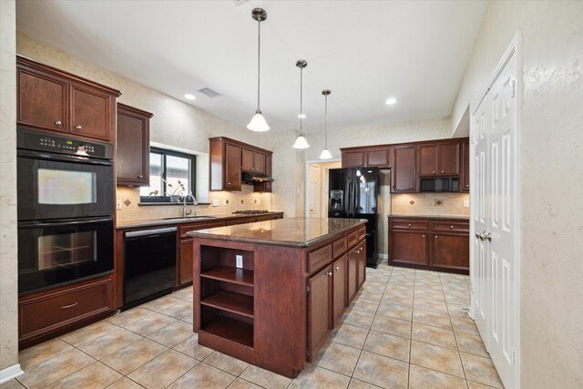 kitchen with pendant lighting, light tile patterned floors, sink, a kitchen island, and black appliances