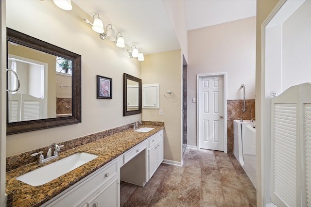 bathroom featuring a shower and vanity