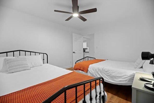 bedroom featuring hardwood / wood-style floors and ceiling fan