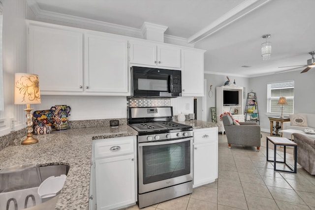 kitchen featuring light tile patterned floors, ceiling fan, white cabinetry, ornamental molding, and stainless steel range with gas cooktop