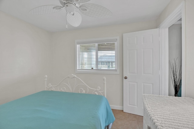 bedroom with light tile patterned flooring and ceiling fan