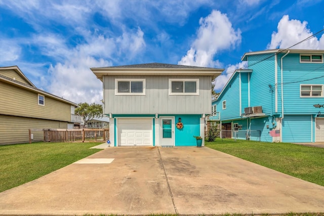 view of front of house with a front lawn, central AC unit, and a garage