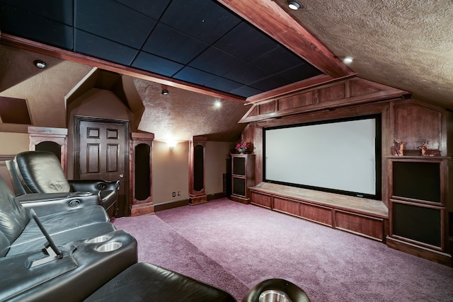 carpeted cinema featuring vaulted ceiling and a textured ceiling