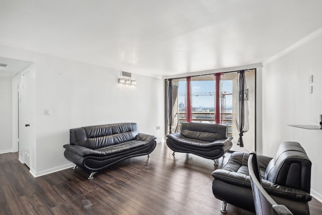 living room with crown molding and dark hardwood / wood-style flooring