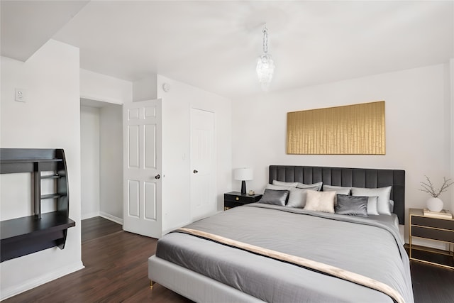 bedroom featuring dark hardwood / wood-style flooring