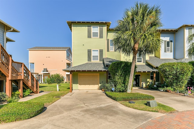 view of front of house featuring a garage and a front yard