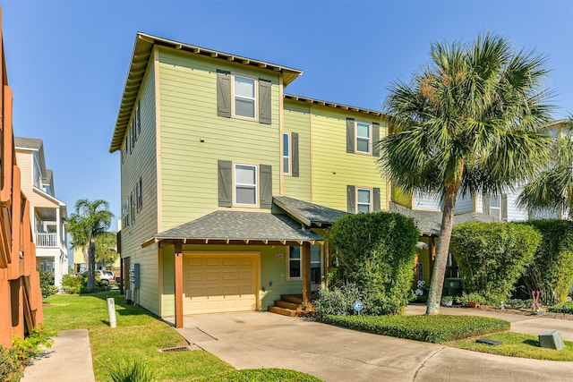 view of front facade with a front yard and a garage