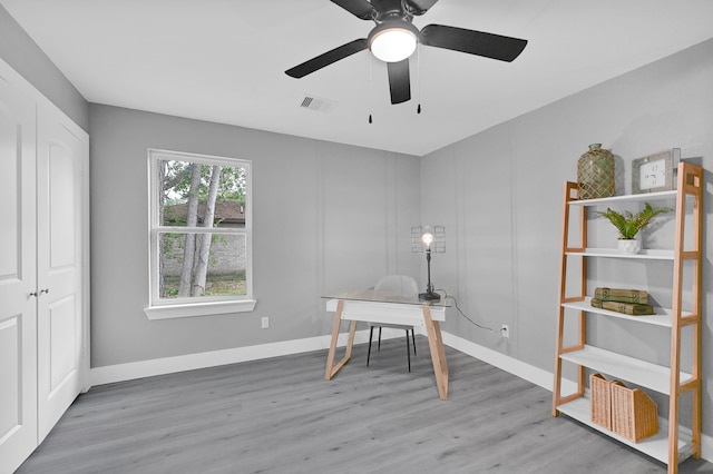 office space featuring hardwood / wood-style flooring and ceiling fan