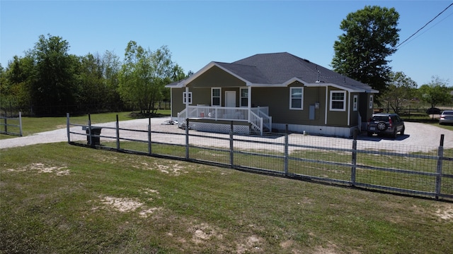 view of front facade with a porch and a front lawn