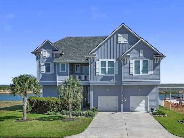 view of front of house featuring a garage and a front lawn