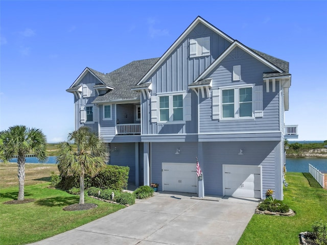 9 Hawkeye, Hitchcock, TX 77563 - coastal inspired home with board and batten siding, a water view, a garage, and a front yard