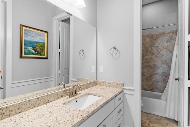 bathroom with shower / bath combo and vanity