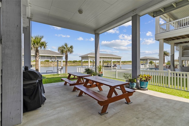 view of patio / terrace featuring a water view and grilling area
