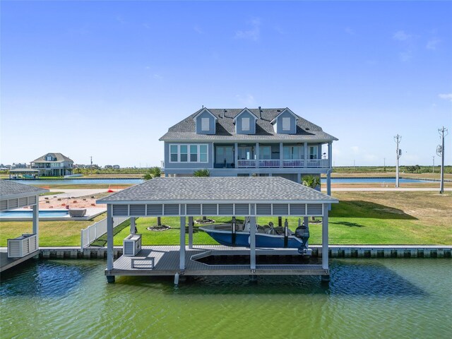 9 Hawkeye, Hitchcock, TX 77563 - dock featuring a water view, boat lift, and a lawn