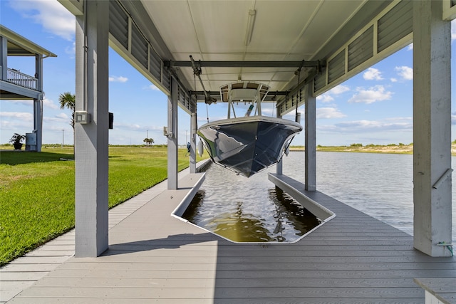 dock area featuring a water view and a lawn