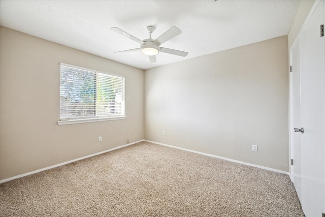 empty room with carpet and ceiling fan