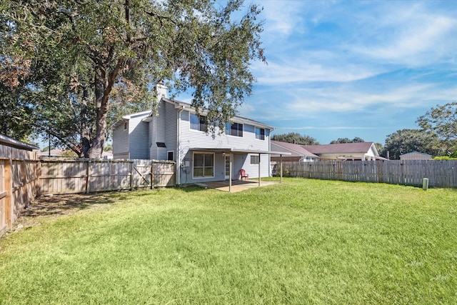 back of property featuring a patio area and a lawn