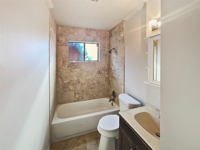 full bathroom featuring a textured ceiling, tiled shower / bath combo, vanity, and toilet