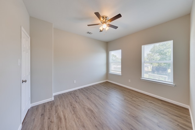 spare room featuring ceiling fan and light wood-type flooring