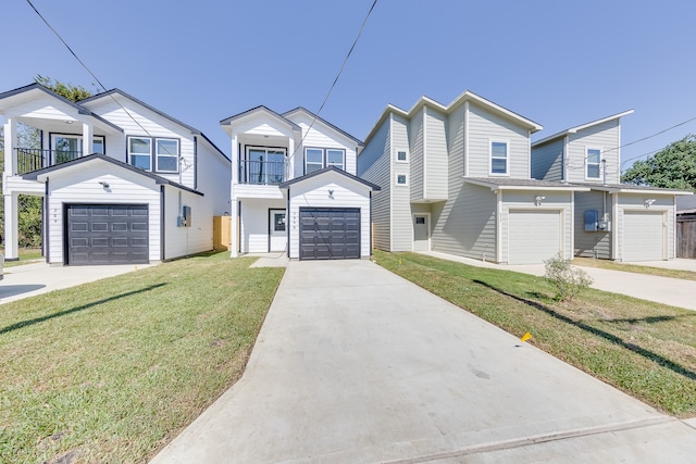 view of property with a front yard, a balcony, and a garage