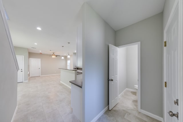 hall with light tile patterned flooring