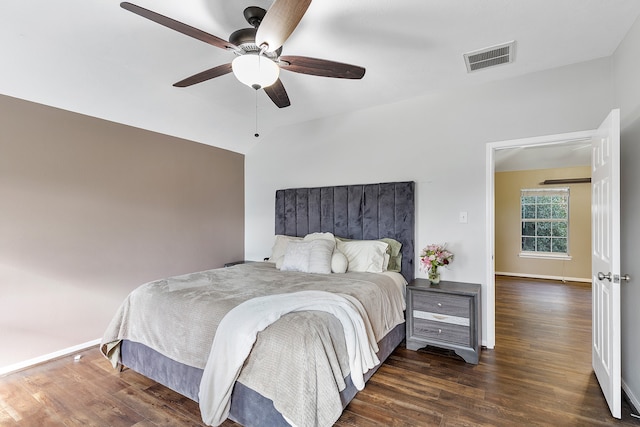 bedroom featuring ceiling fan, lofted ceiling, and dark wood-type flooring