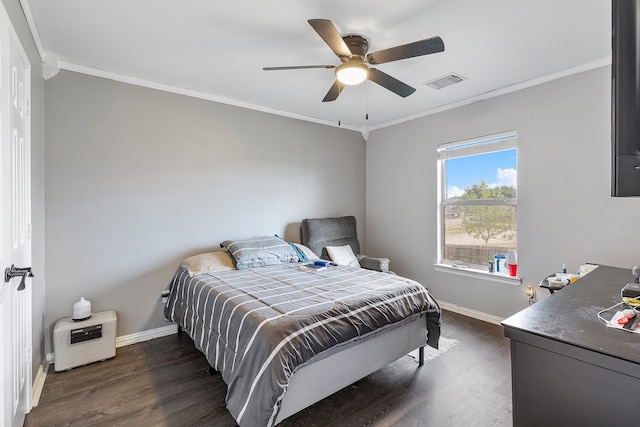 bedroom with crown molding, ceiling fan, and dark wood-type flooring