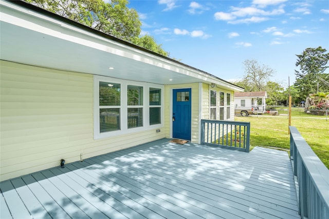 deck featuring a lawn