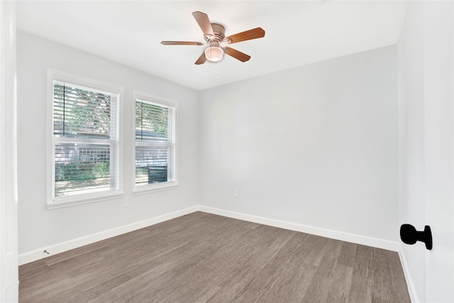 spare room featuring ceiling fan and hardwood / wood-style floors