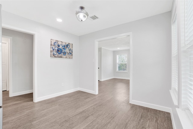 empty room with light hardwood / wood-style floors