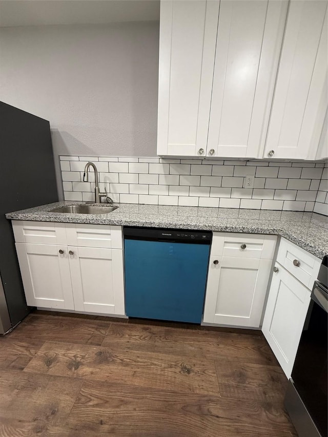 kitchen featuring a sink, white cabinetry, light stone counters, and dishwasher