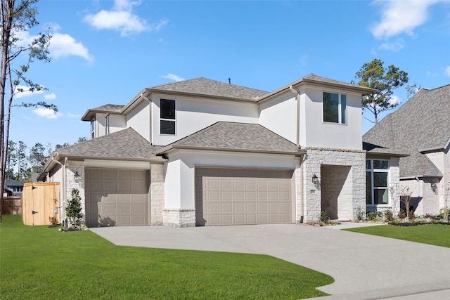 view of front of home with a front lawn and a garage