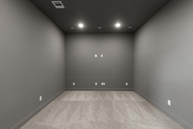 empty room featuring light carpet