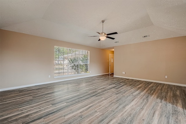 unfurnished room with wood-type flooring, a textured ceiling, vaulted ceiling, and ceiling fan