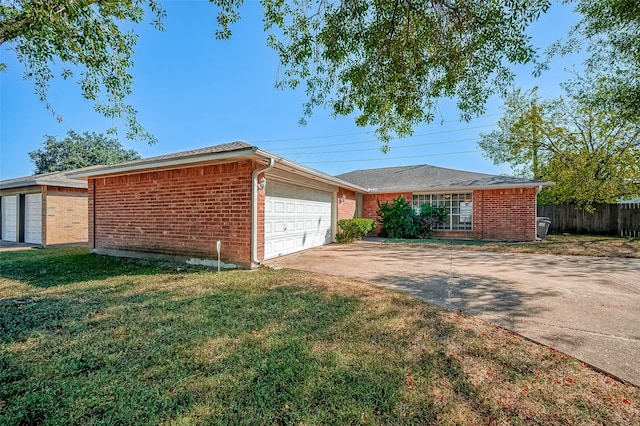 ranch-style house with a front yard and a garage