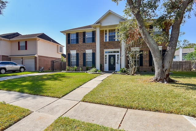 view of front of house featuring a front yard and a garage