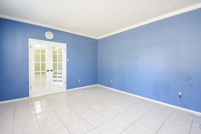 spare room with french doors, a textured ceiling, and crown molding