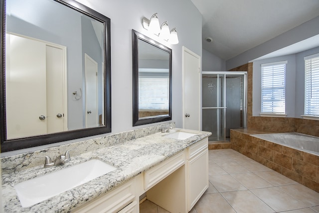 bathroom with vanity, tile patterned floors, lofted ceiling, and separate shower and tub