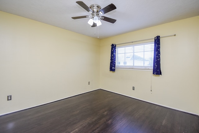 empty room featuring hardwood / wood-style flooring and ceiling fan