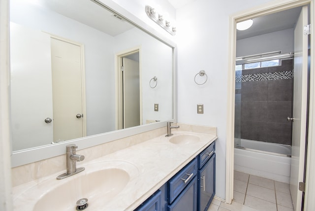 bathroom featuring vanity, bath / shower combo with glass door, and tile patterned flooring