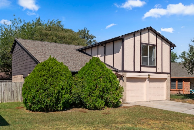 tudor-style house with a front lawn and a garage