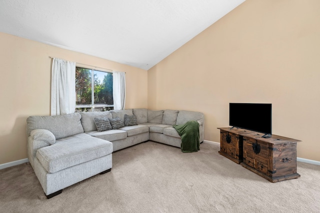 living room with lofted ceiling and carpet flooring